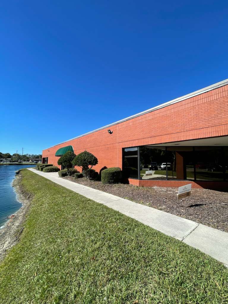 HVAC technician performing AC maintenance in Jacksonville Florida